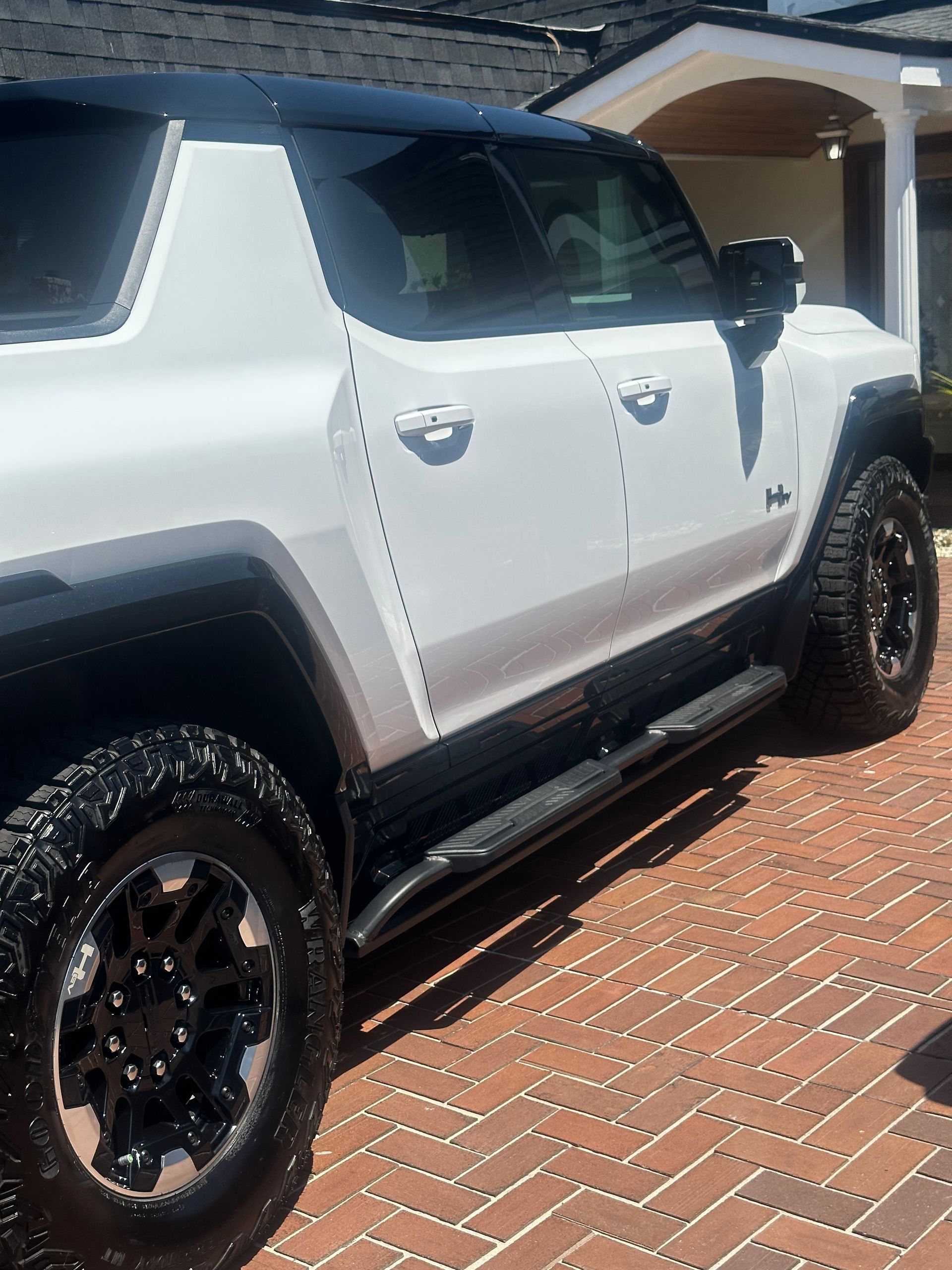 Passenger side of a white SUV type vehicle