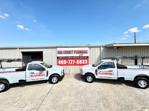 Mid County Plumbing building and trucks