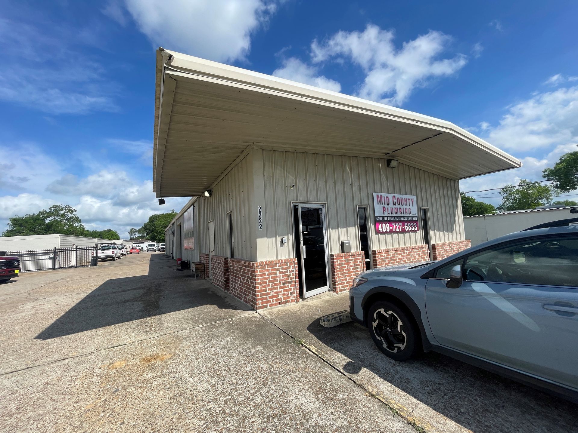 A car is parked in front of a building.
