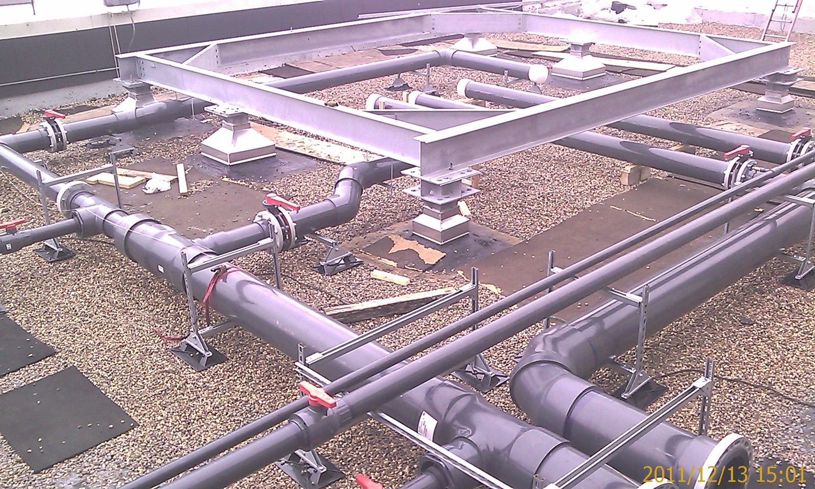 A bunch of pipes are connected to a metal frame