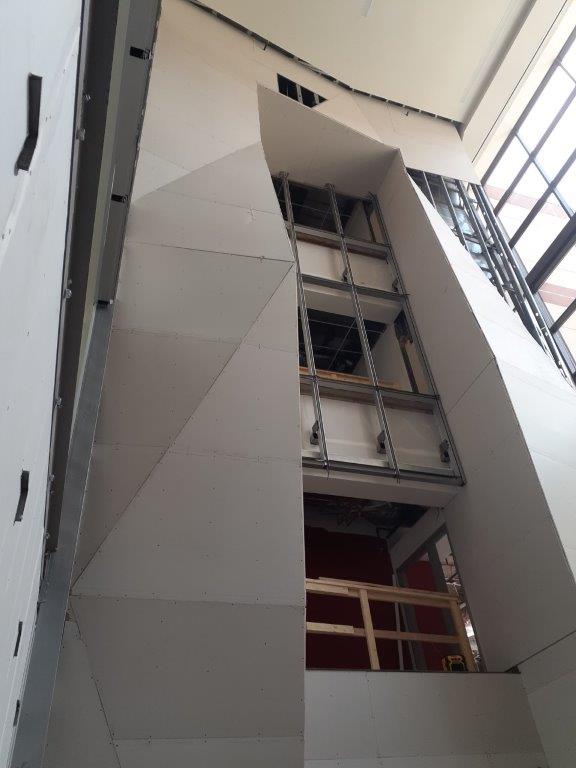 Looking up at a very tall building with stairs