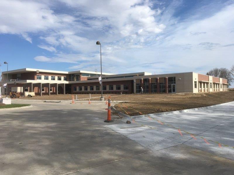 A large building with a lot of windows is being built.