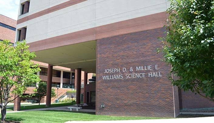 A brick building with a sign that says joseph d & millie williams science hall