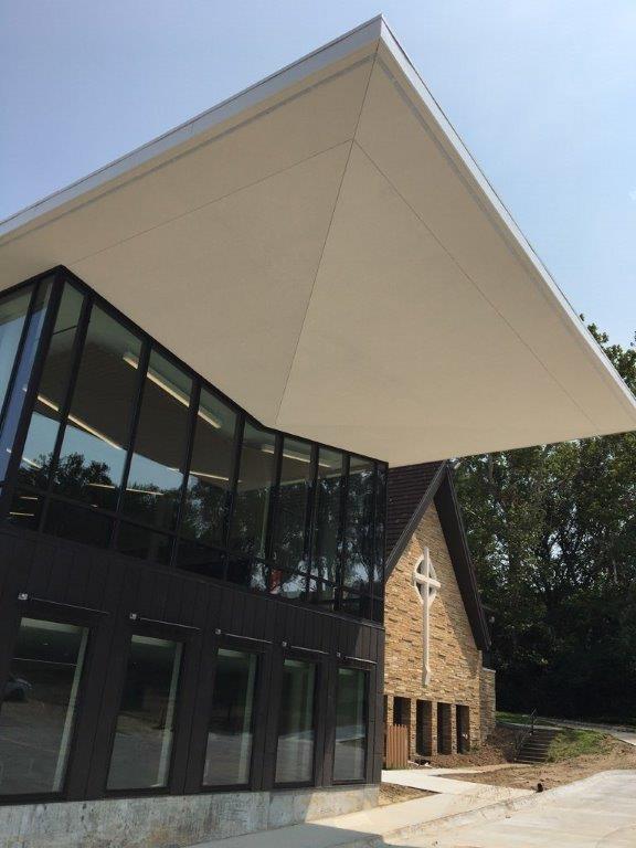 A large building with a cross on the side of it