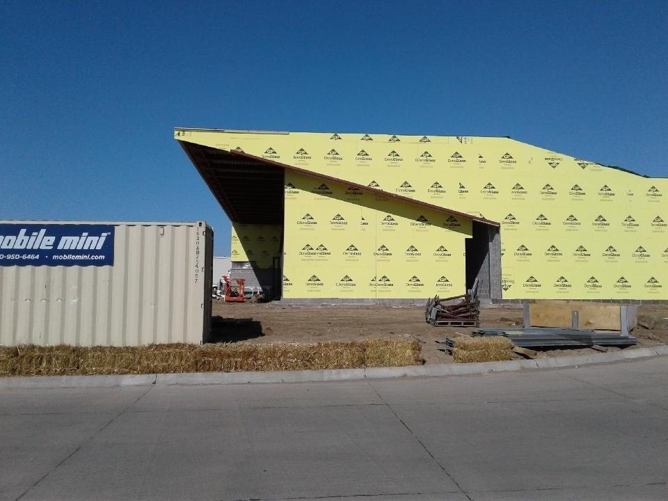 A building under construction with a sign that says mobile mind