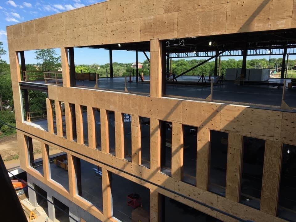 A large building under construction with a lot of windows