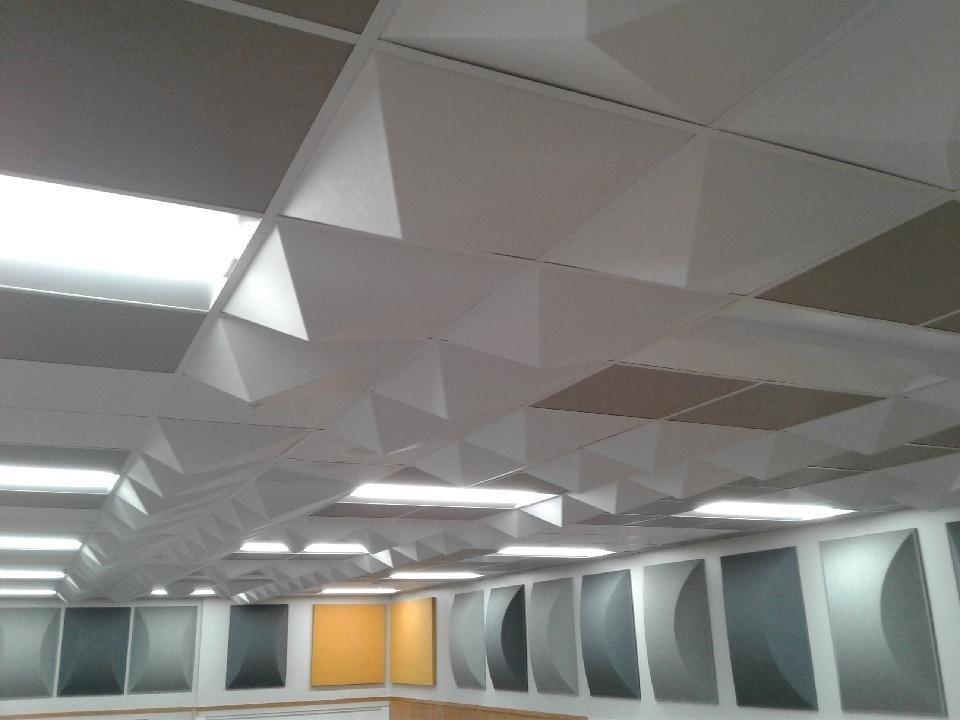 A room with a lot of triangles on the ceiling