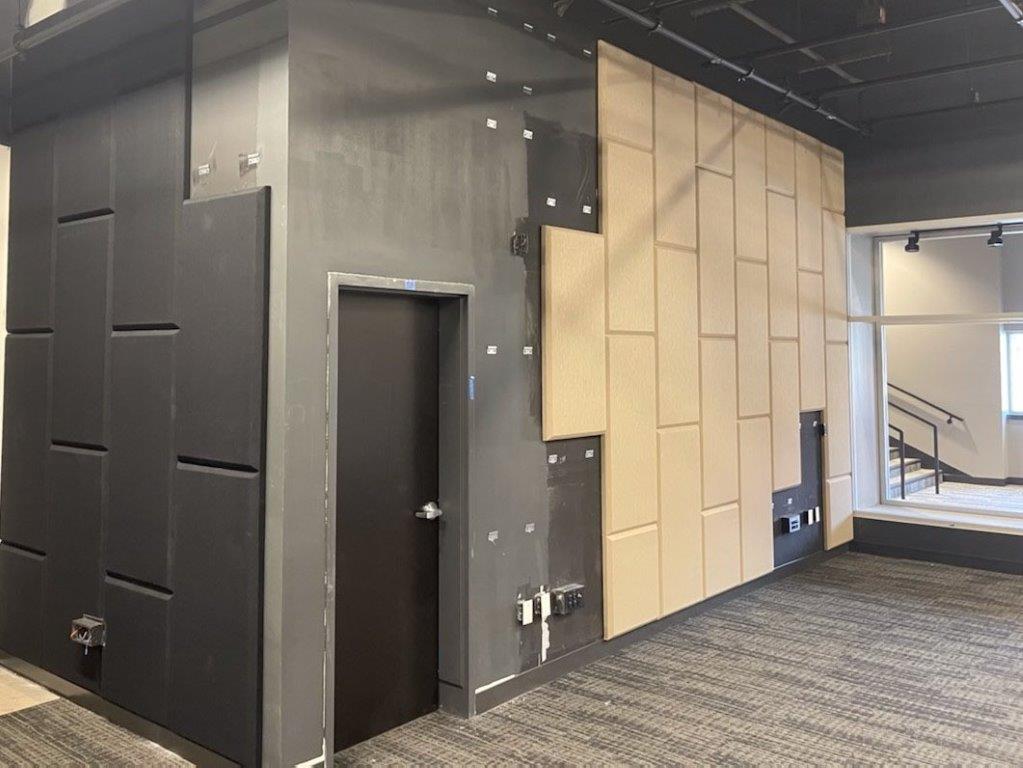 There is a door in the corner of the room.