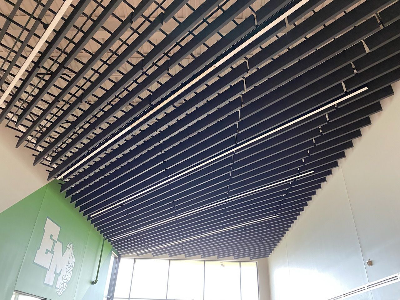 A beautiful ceiling with a green wall in the background