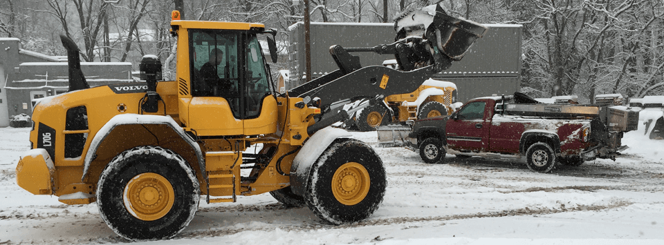 Front end loader and pick-up truck with plow - working in the snow Glen Mills, PA