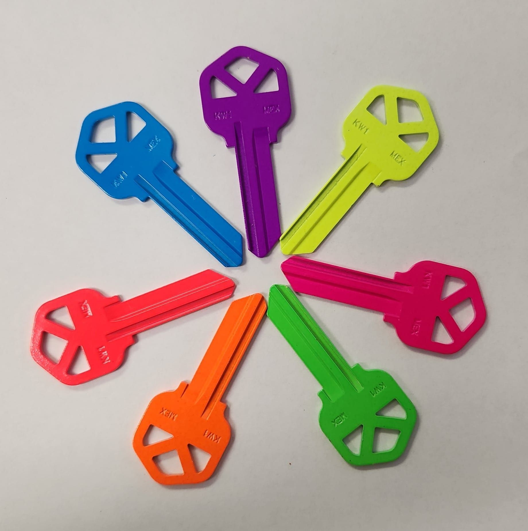 Seven brightly colored keys arranged in a circle; blue, purple, yellow, pink, green, orange, and red.