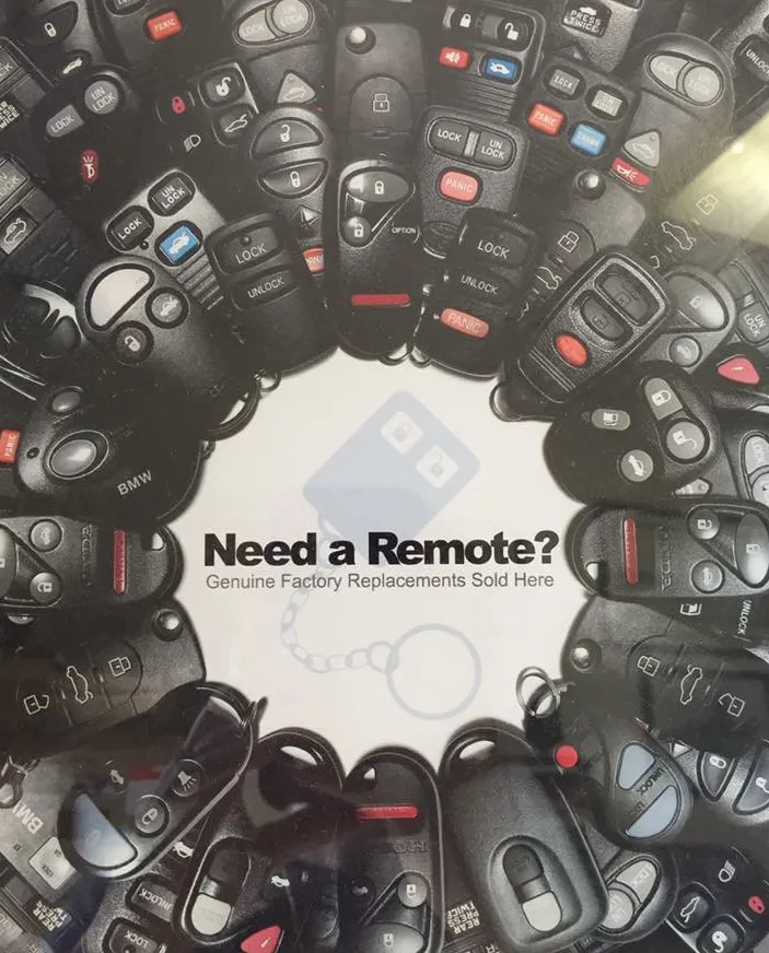 Assortment of black car remotes with the text 