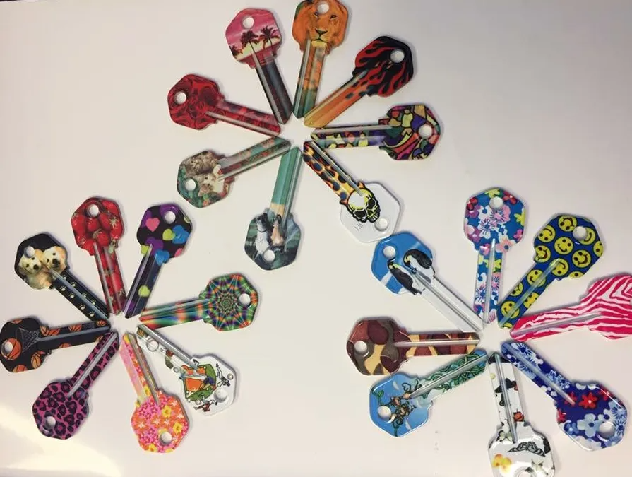 Three clusters of colorful patterned keys arranged on a white surface.