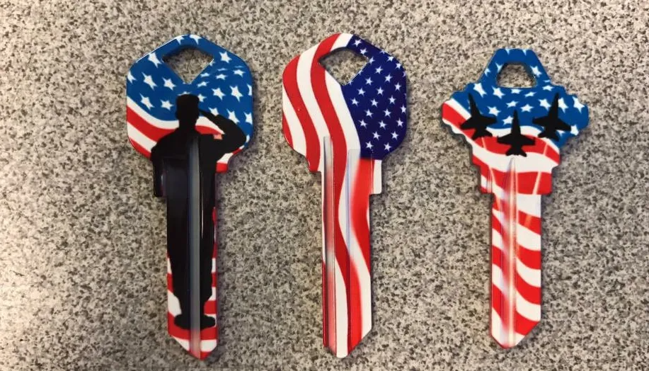 Three patriotic keys with American flag designs: stars/stripes.