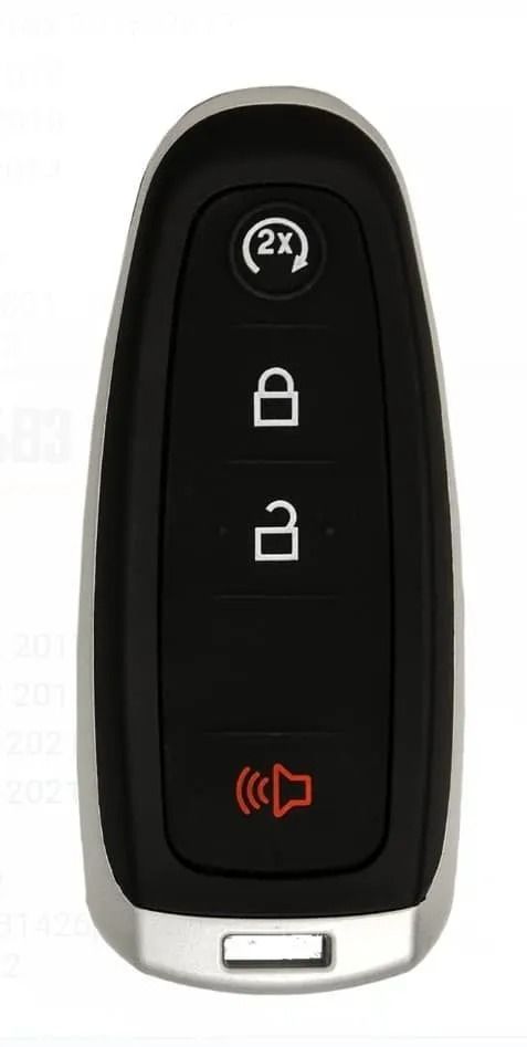 Black car key fob with lock, unlock, remote start, and panic buttons, silver trim