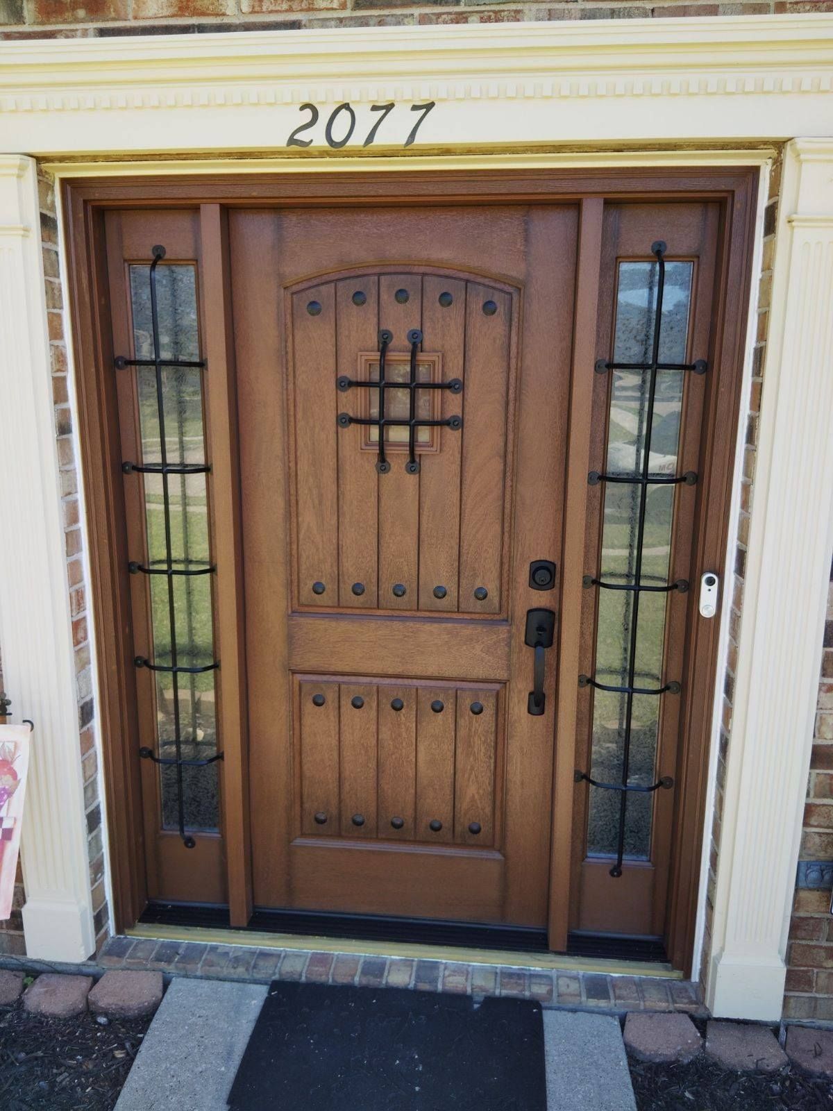 A wooden door with the number 2077 on it