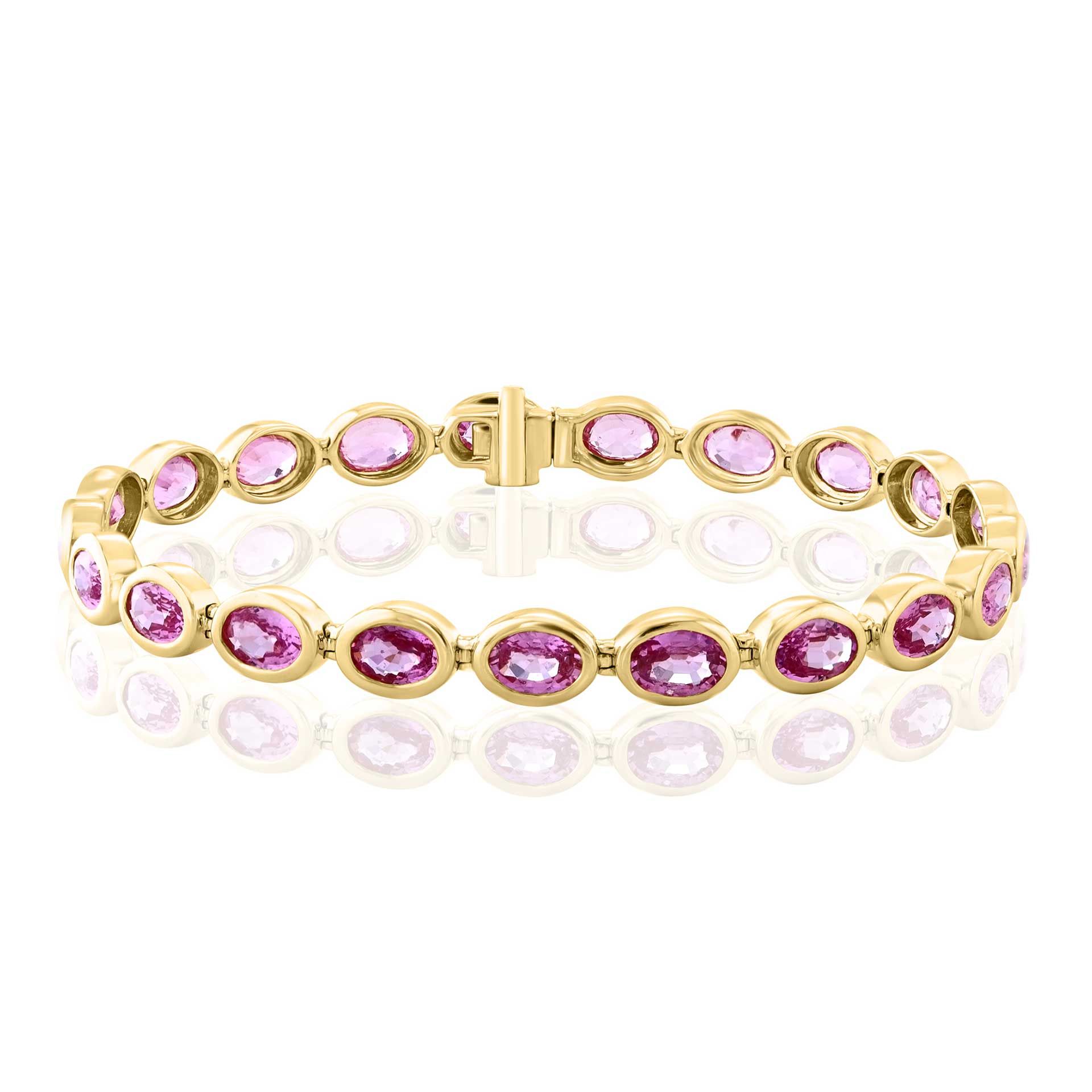 Gold bracelet with oval pink gemstones on a white background