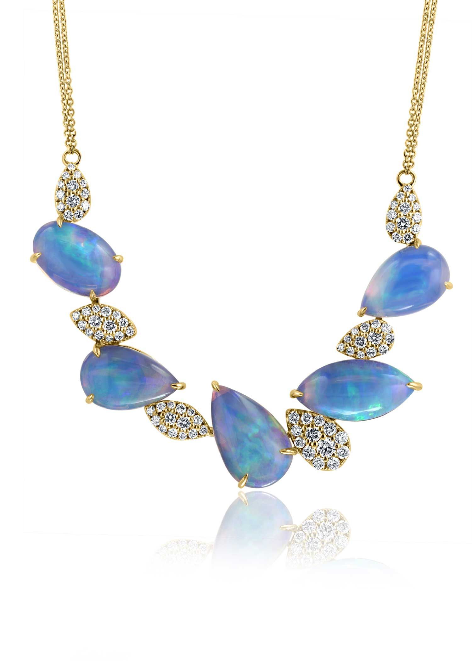 Gold necklace with blue opal teardrop stones and clear crystal accents