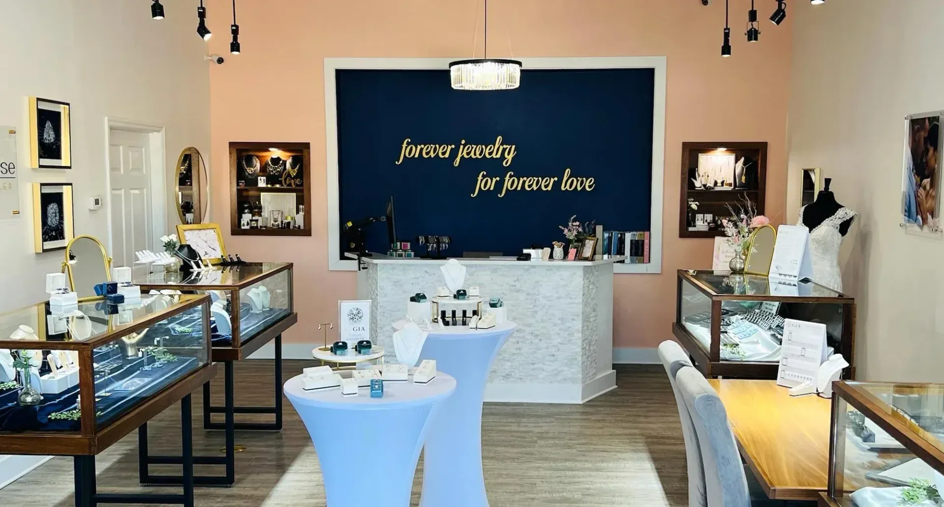 Necklaces and rings on display in a jewelry store. Gold necklaces with pendants and diamond rings.
