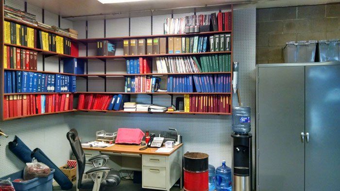 Chuck and Larry’s Transmission office with a lot of books