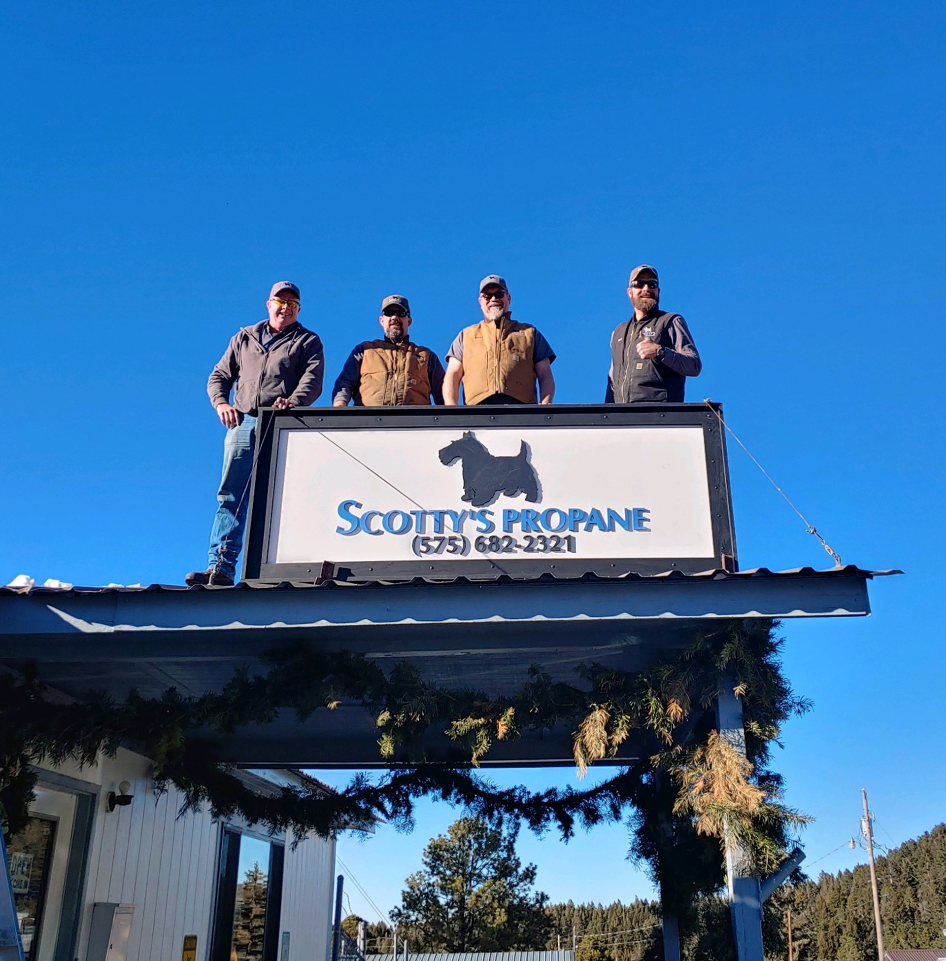 The professionals at Scotty's Propane sign.