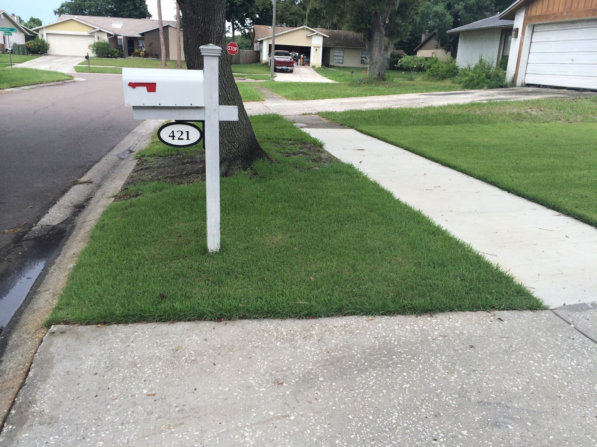 A white mailbox with the number 42 on it