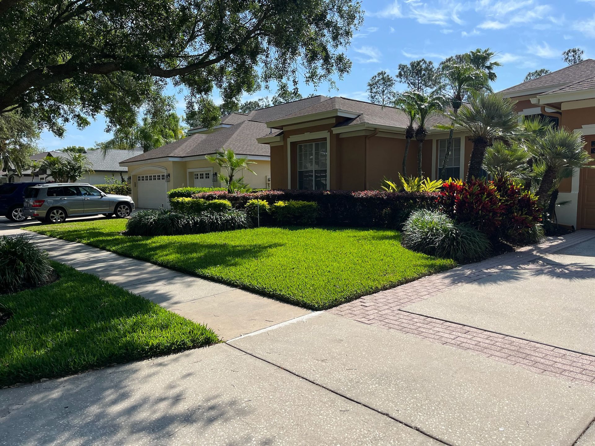 A house with a car parked in front of it