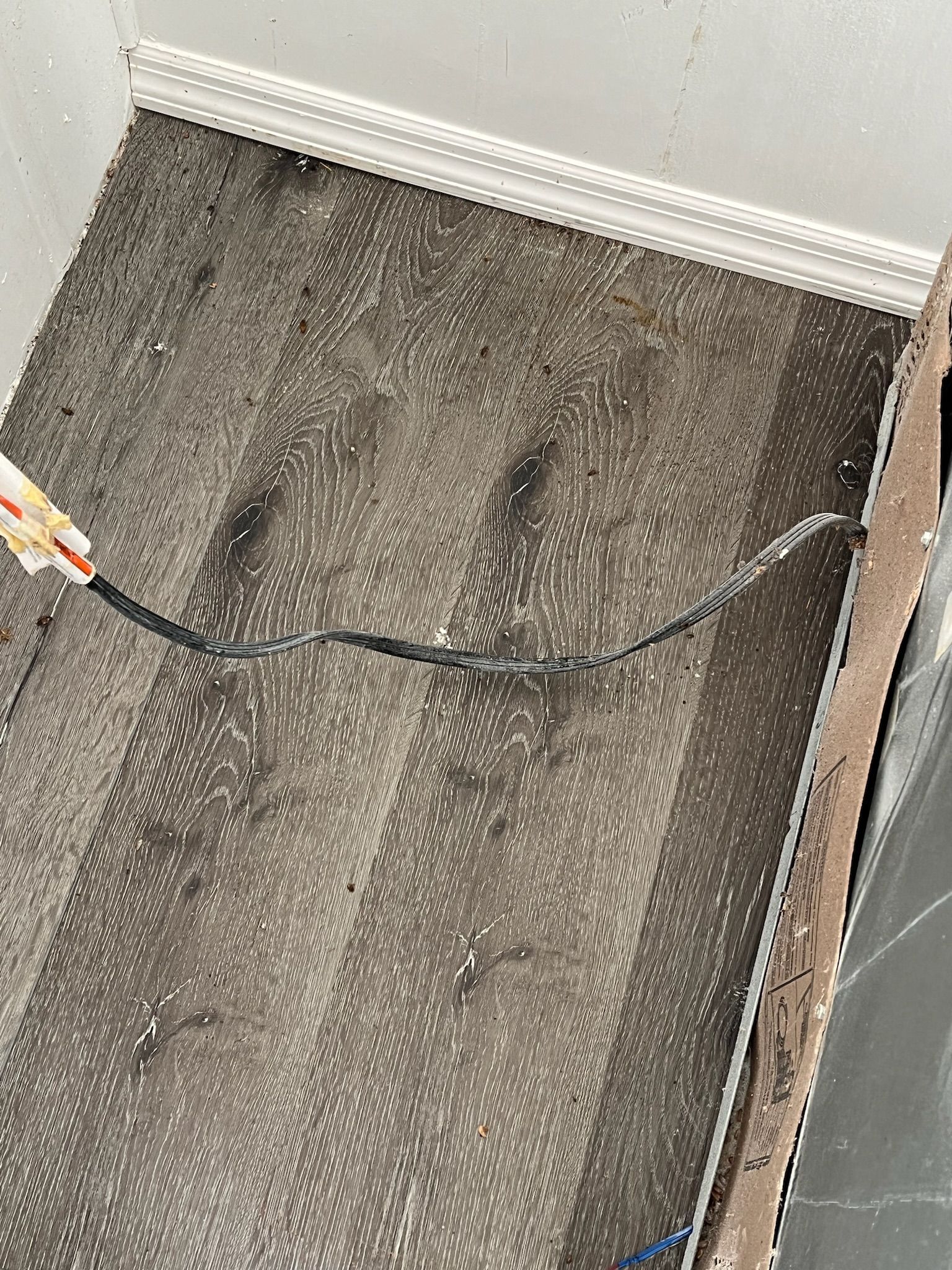 A close up of a box with a wire coming out of it.