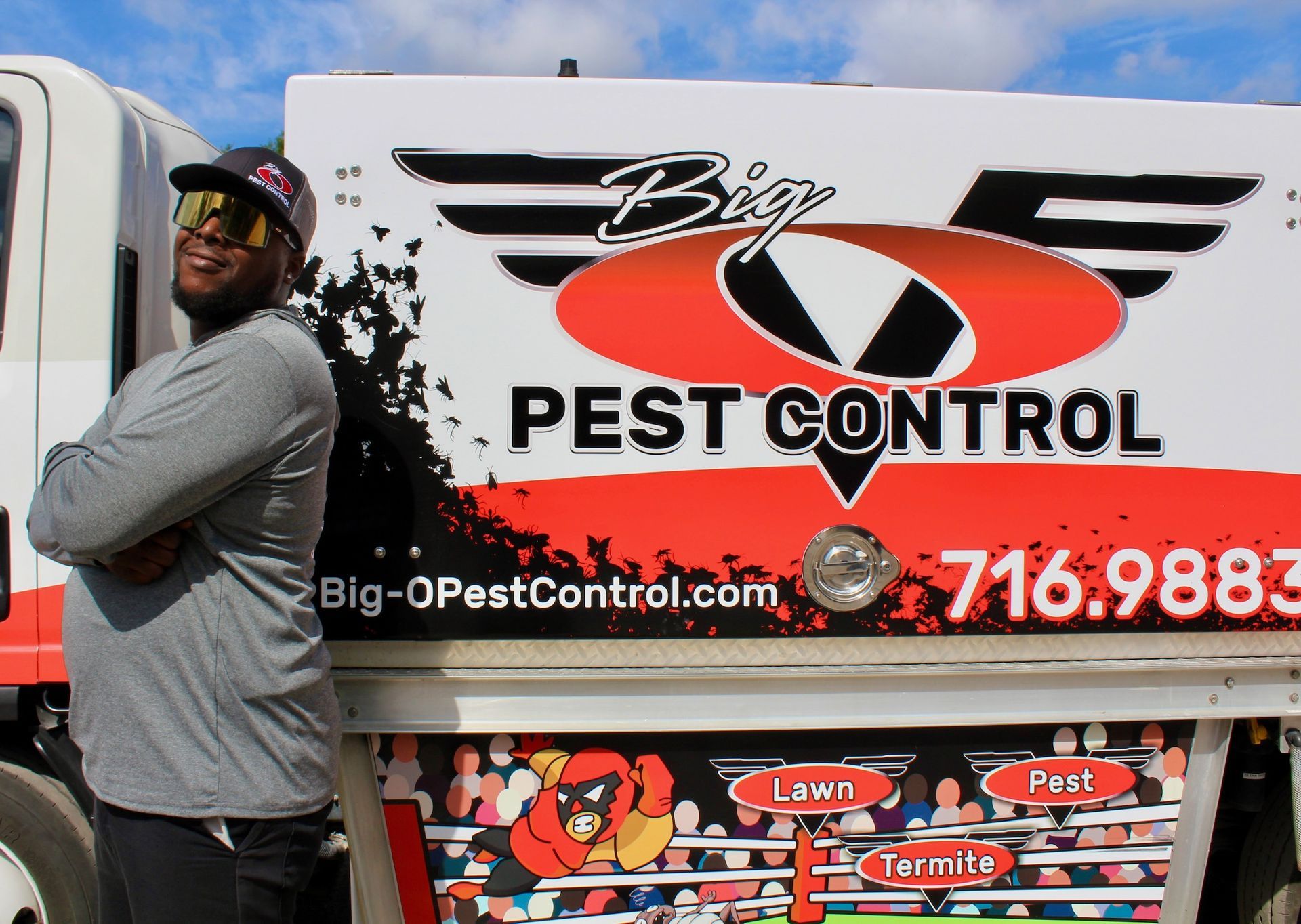 A man standing in front of a big pest control truck