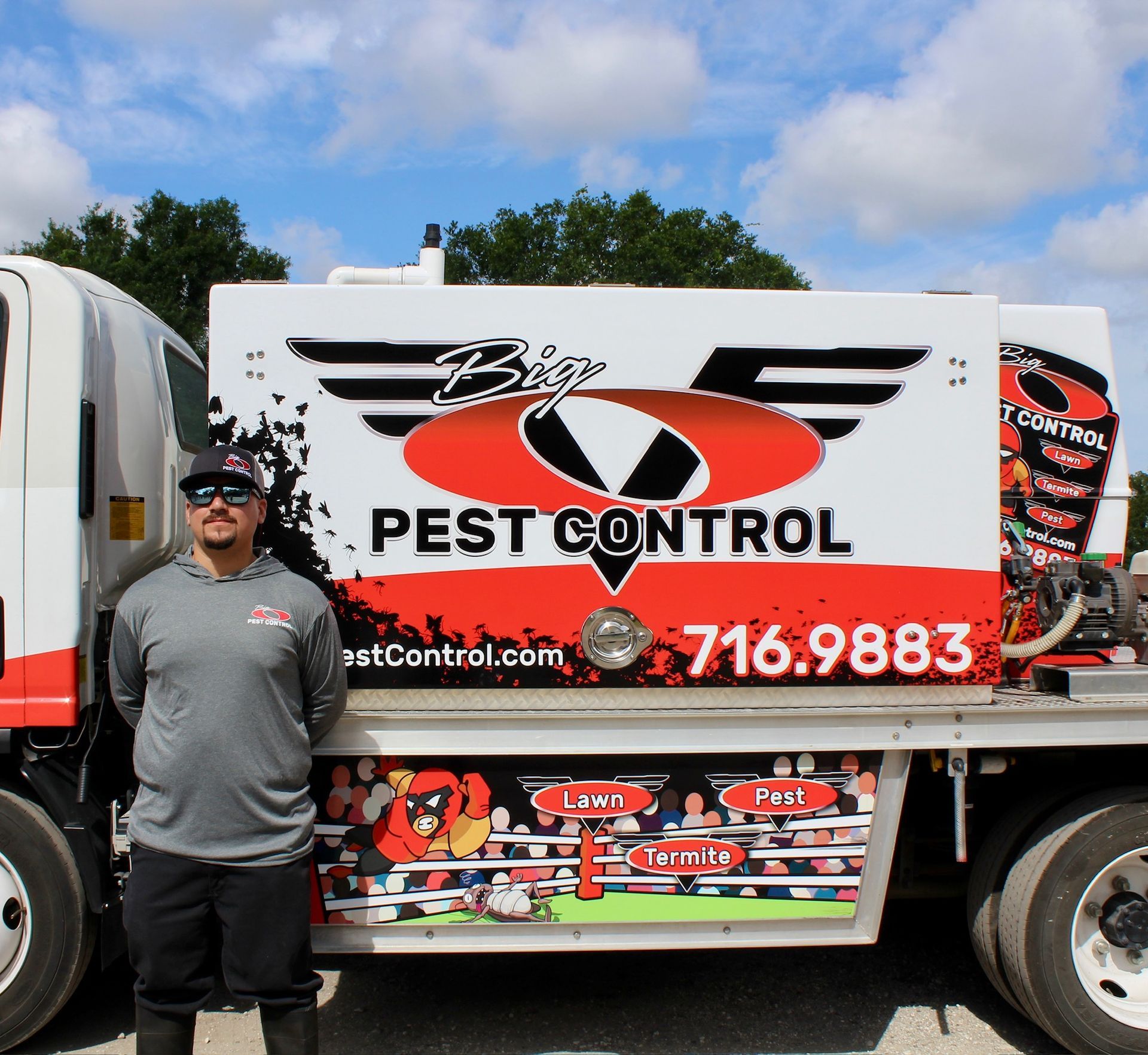 A man stands in front of a pest control truck