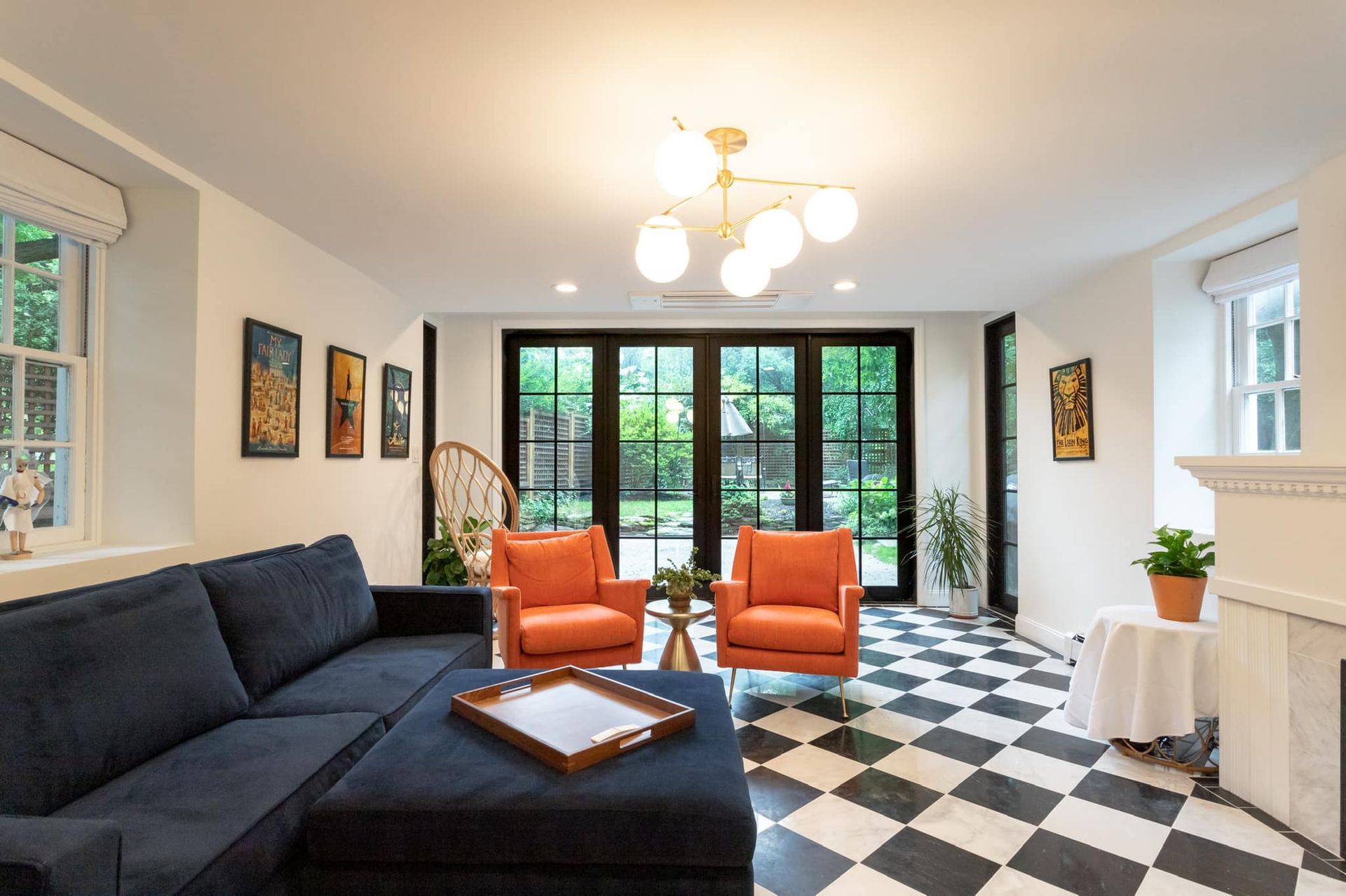 Gray home generator in a flower garden.