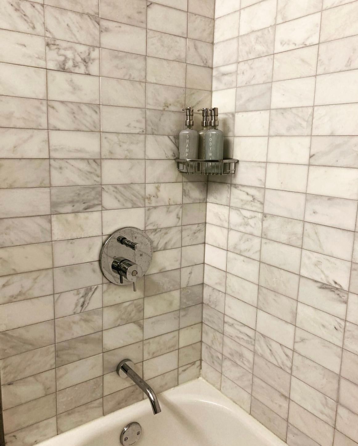 Restroom with white installed patterned tiles design