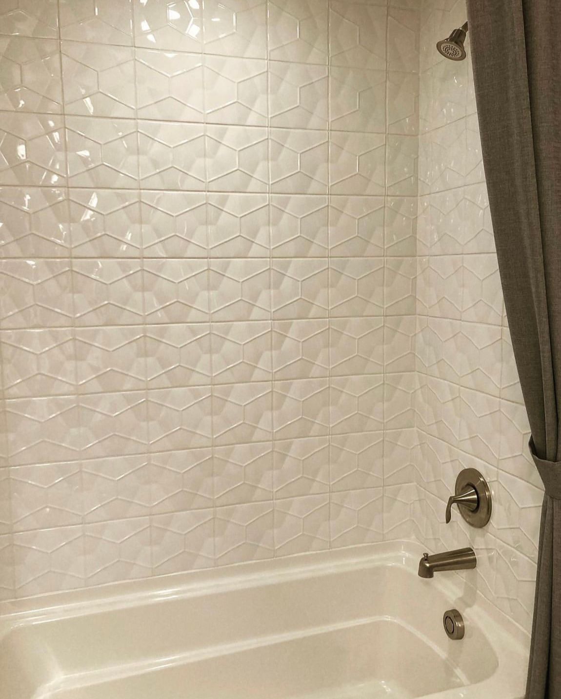 Restroom with bath tub and patterned tiles design