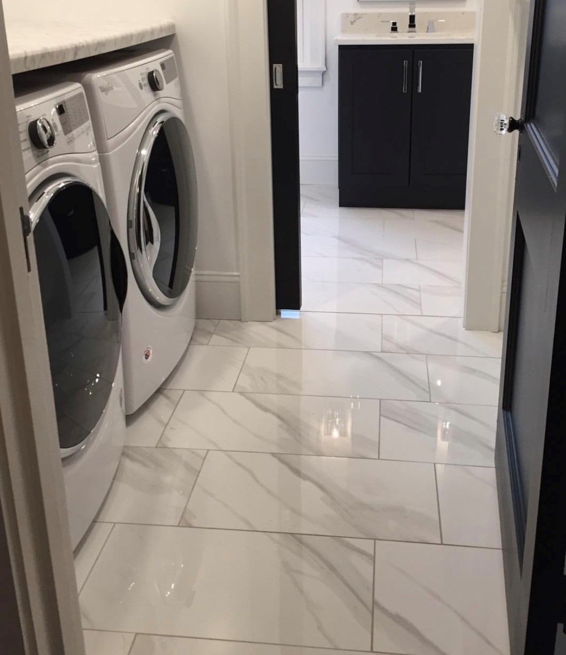 A laundry room with a washer and dryer in it