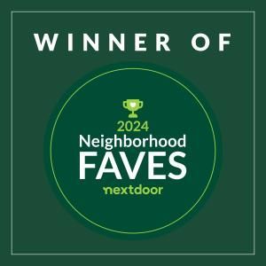 A green circle with the words `` winner of neighborhood faves nextdoor '' on it.