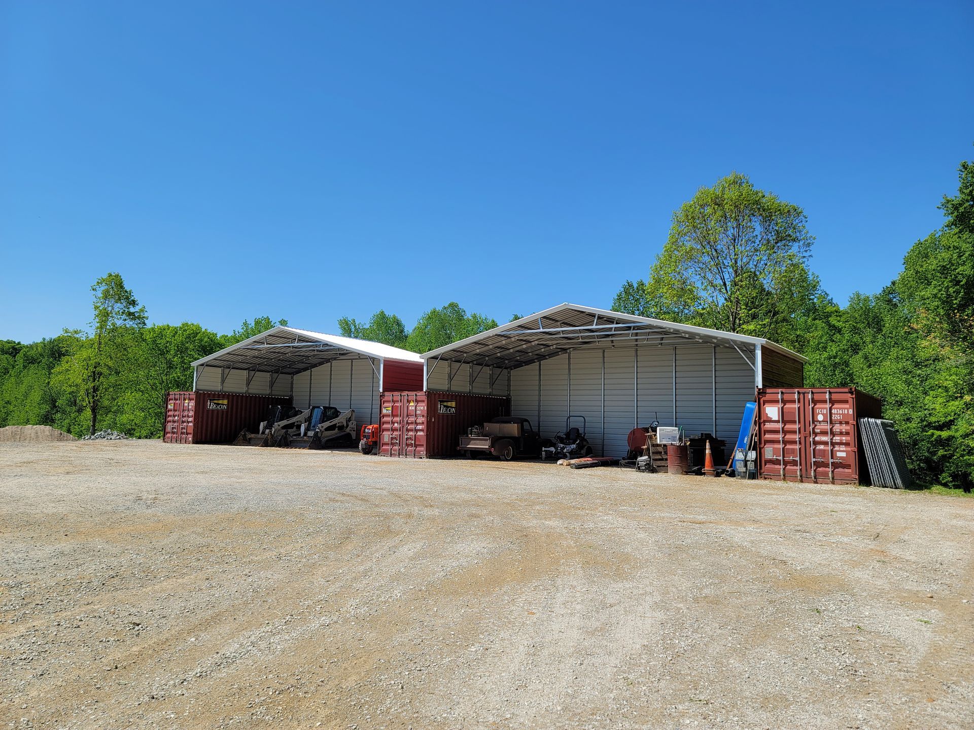 Two metal parking with trucks
