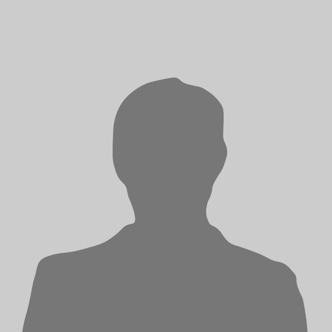 A silhouette of a man without a face on a gray background.