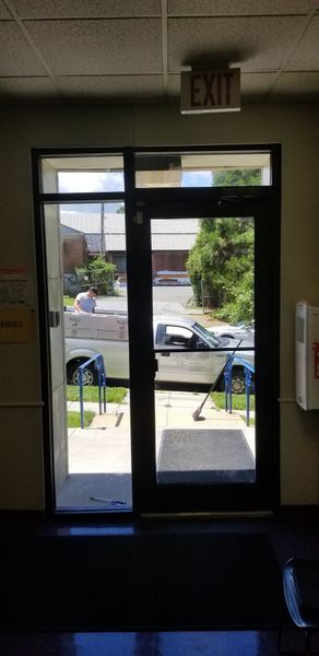 An open glass door with an 