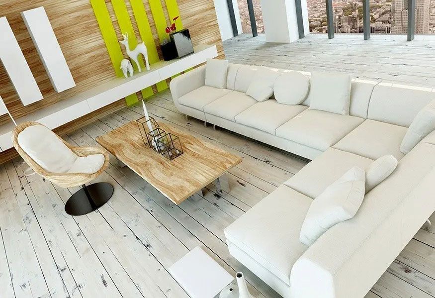 Modern white living room with sectional sofa, wooden coffee table, and chairs on a light plank floor