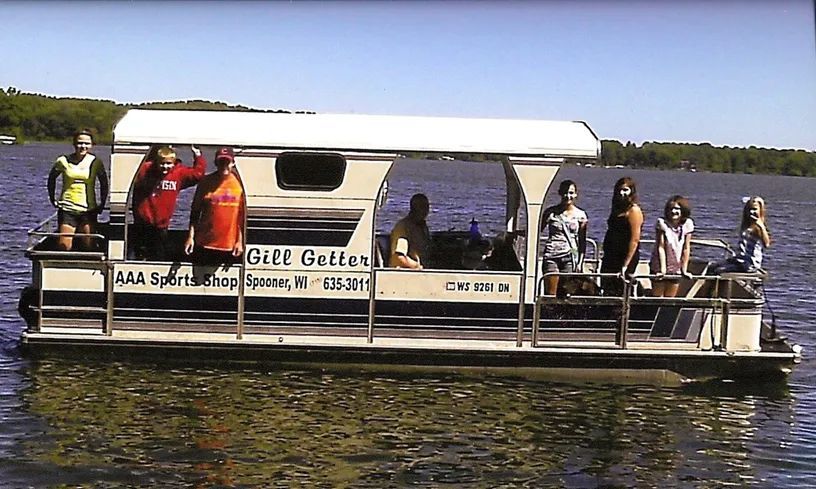 A group of people are on a boat that says bill o'sullis