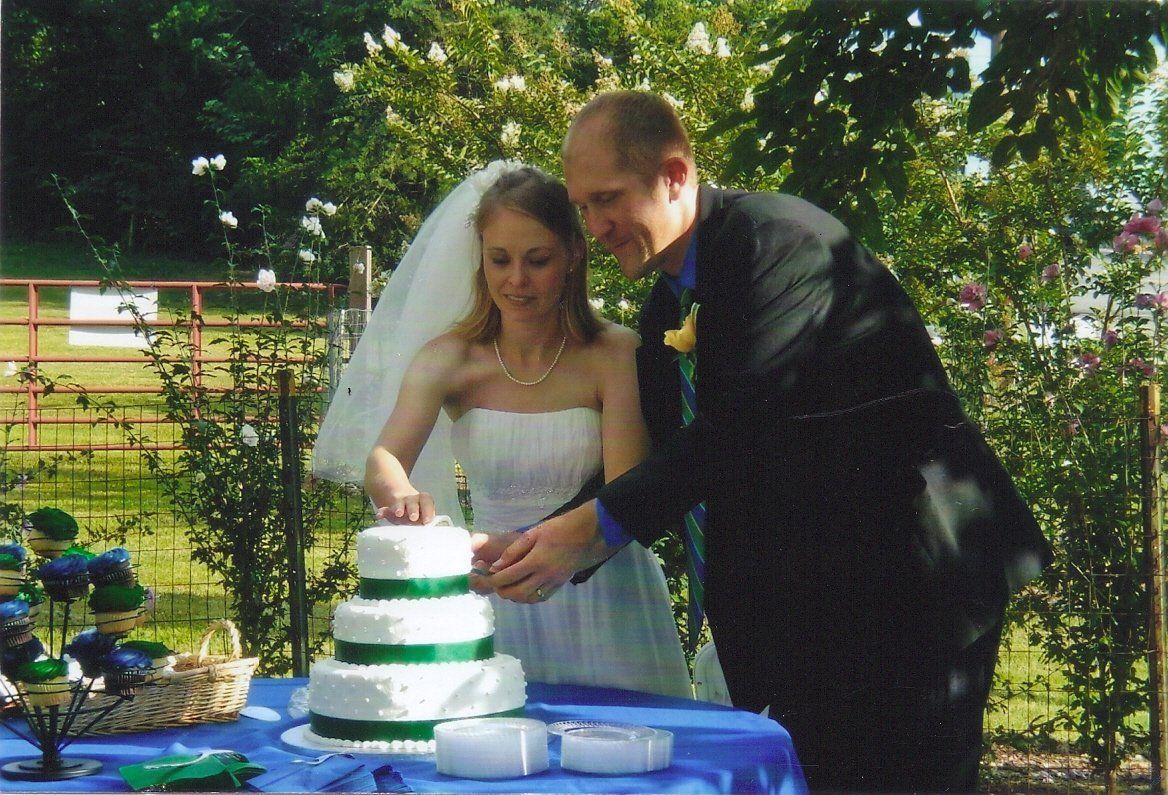 Couple cutting their wedding cake