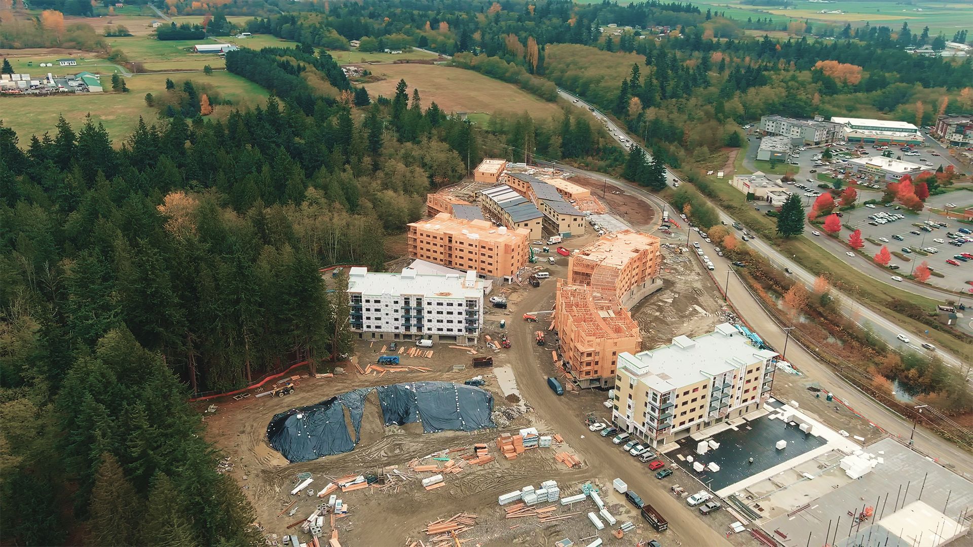 Aerial view of a construction site with apartment buildings