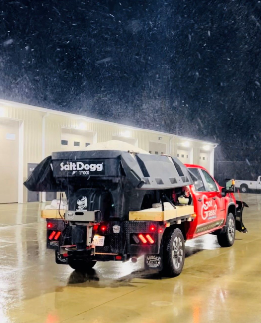 a salt dogg truck is parked in front of a building
