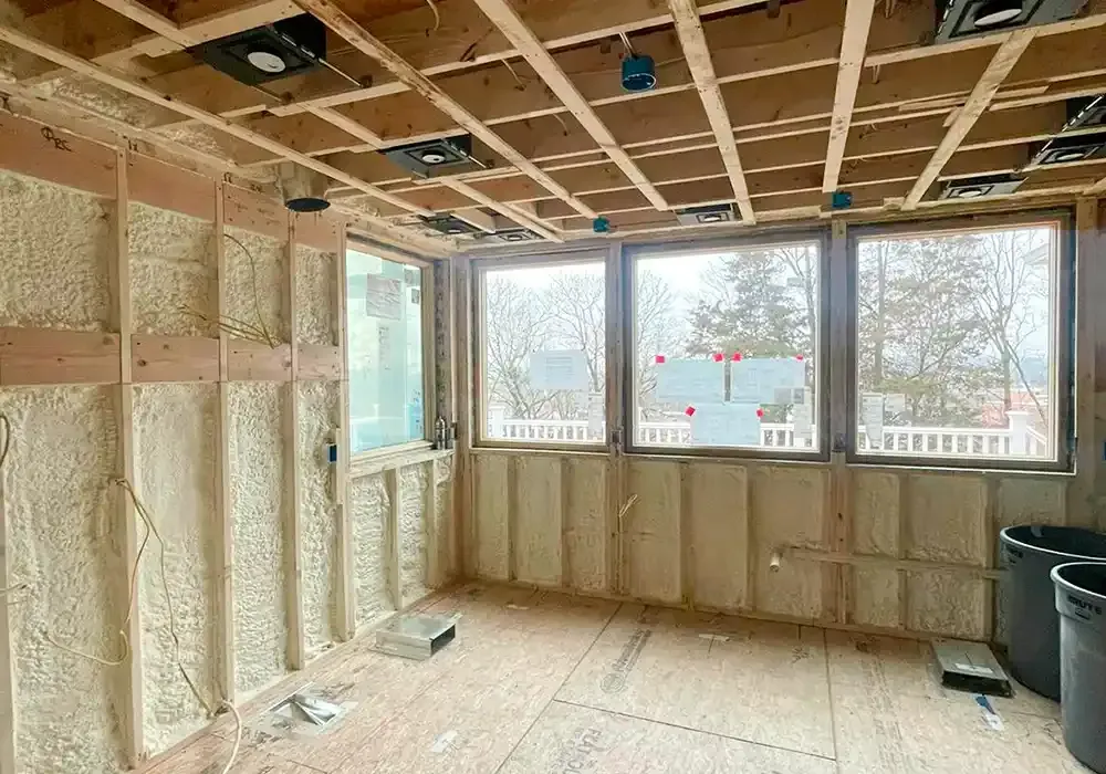 A room with a lot of windows and foam on the walls.