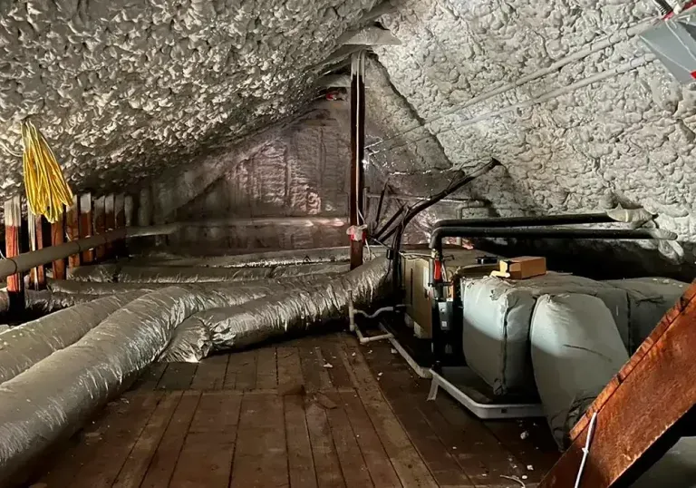 There are a lot of pipes in the attic.