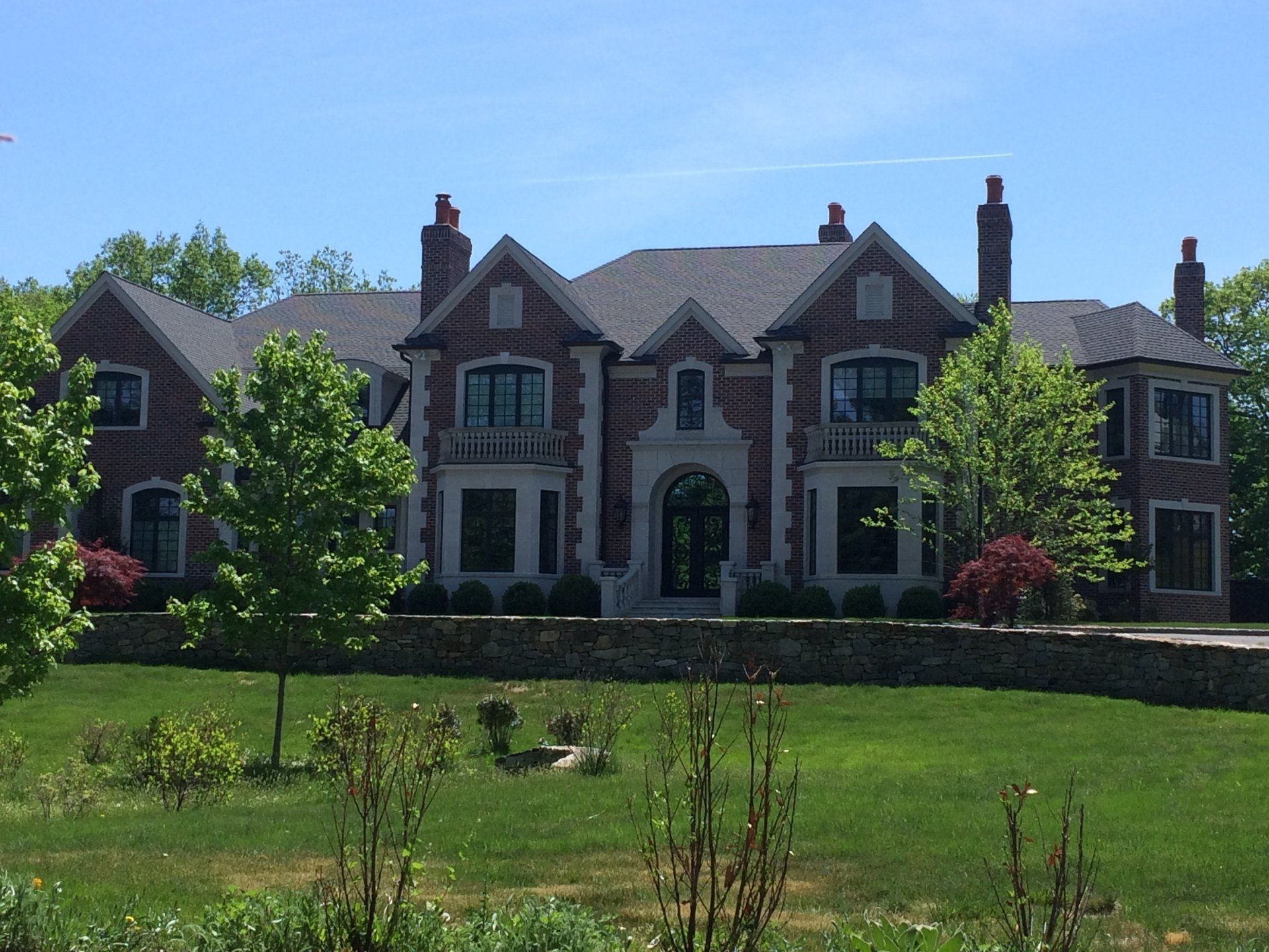 Huge brick house with asphalt roofing
