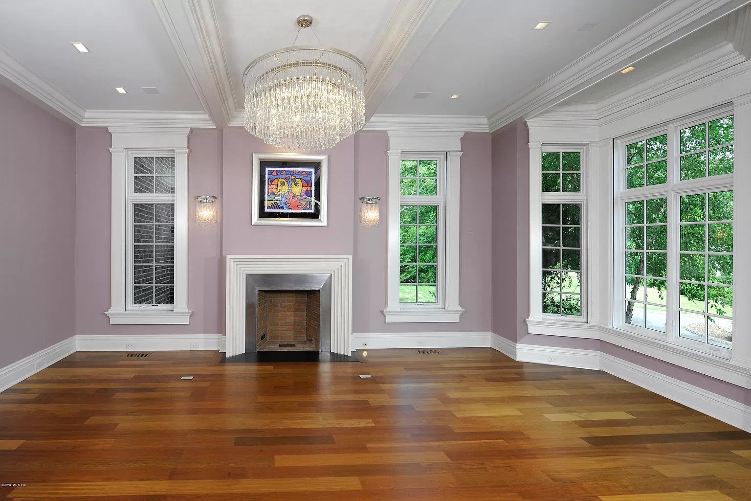 Hardwood flooring and pink walls