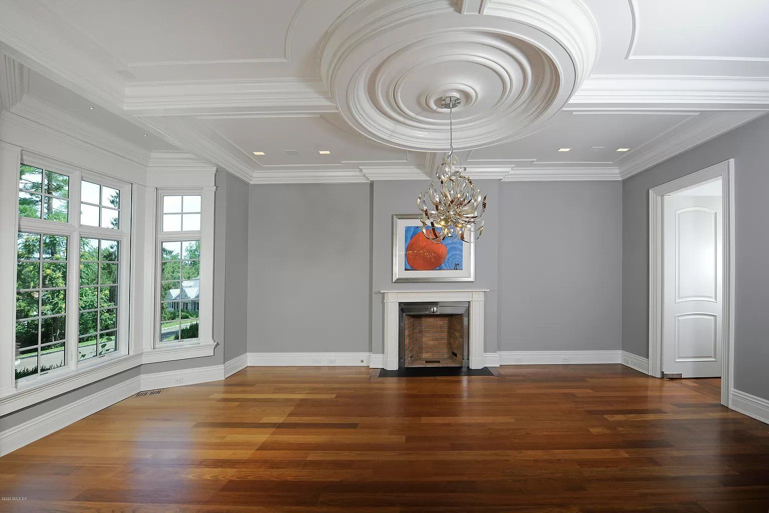 Hardwood flooring and gray walls