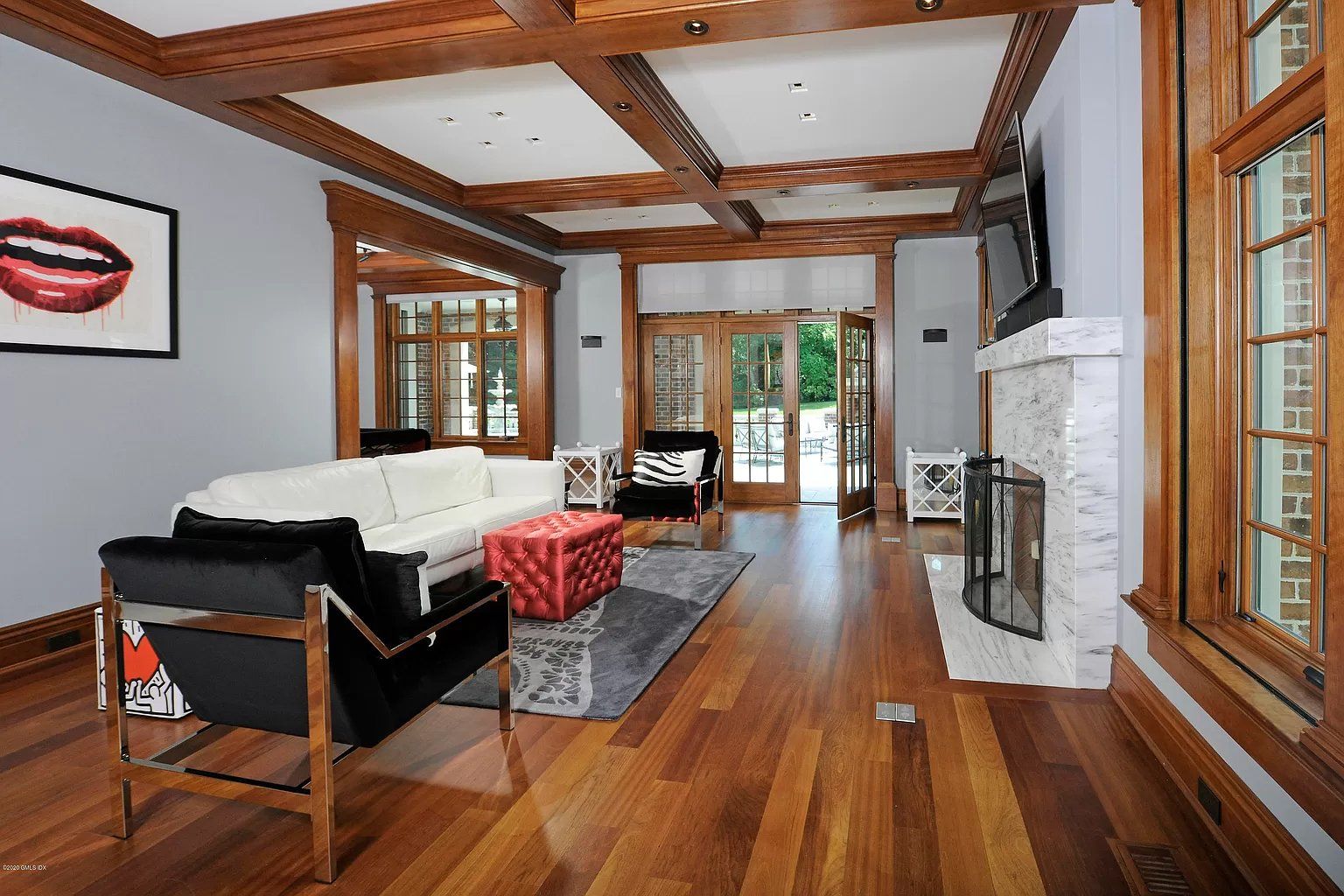 Living room with hardwood flooring and beams