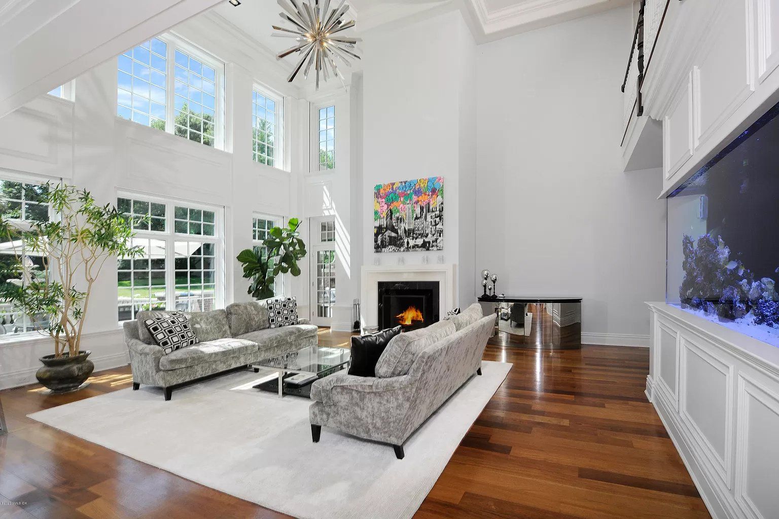 Living room with white walls and high ceiling